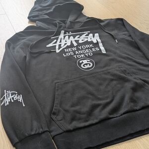 Stüssy World Tour Hoodie Black Spellout Logo New York LA Tokyo Mens Size Lareg